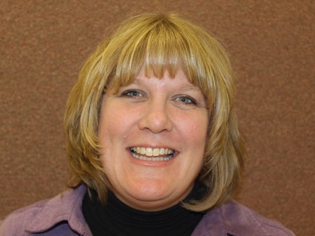 Sandy Zalewski, public relations director for Joliet's public grade schools, makes $140,000 a year in salary. 