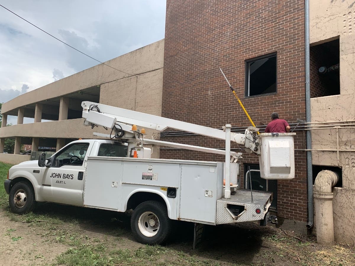 This week, weather permitting, John Bays will have his crews repaint the entire Scott Street Parking Deck. Joliet sold the garage to Bays in May. 