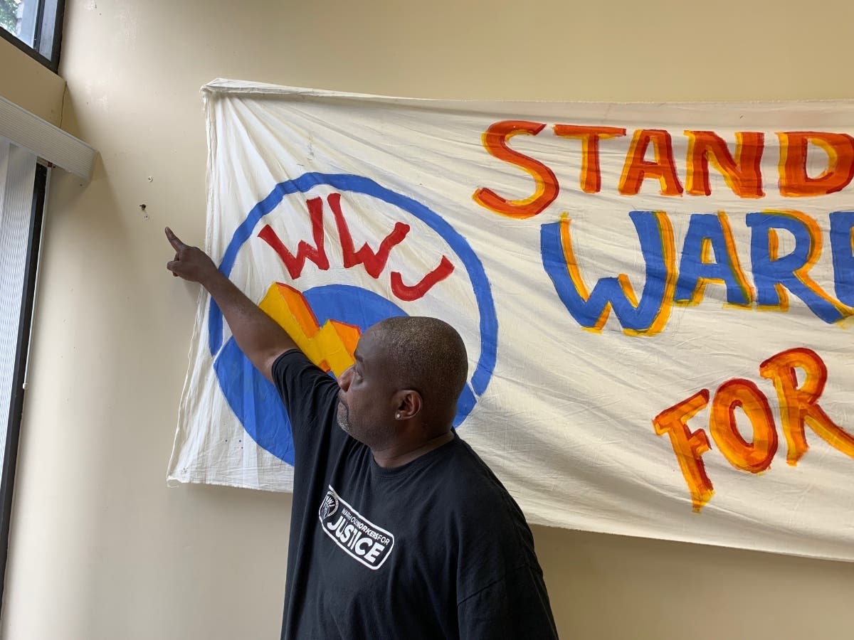 Mark Balentine shows Joliet Patch's editor where Monday afternoon's bullet struck a wall inside the Warehouse Workers for Justice office in downtown Joliet. 