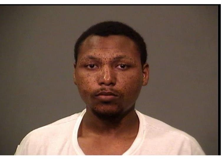 Keon Spencer was arrested by Joliet police after disposing his stolen gun following a wreck, police said. 