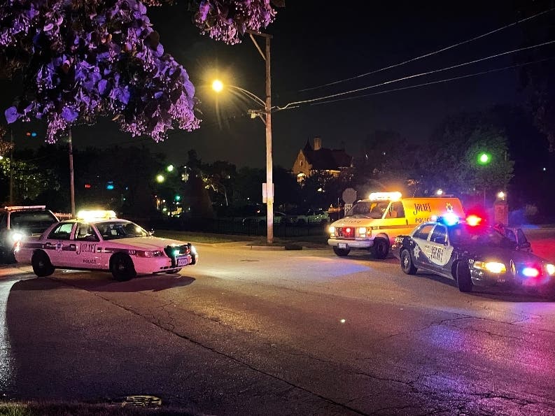 Joliet police cars on the scene of Thursday night's shooting on North Hickory Street. 