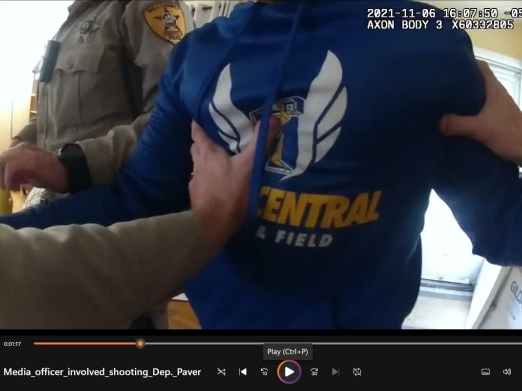 Moments after directing Will County Sheriff's Deputy Nick Binnendyk into the house, Jabbar Muhammad's brother runs inside crying after seeing his brother shot.