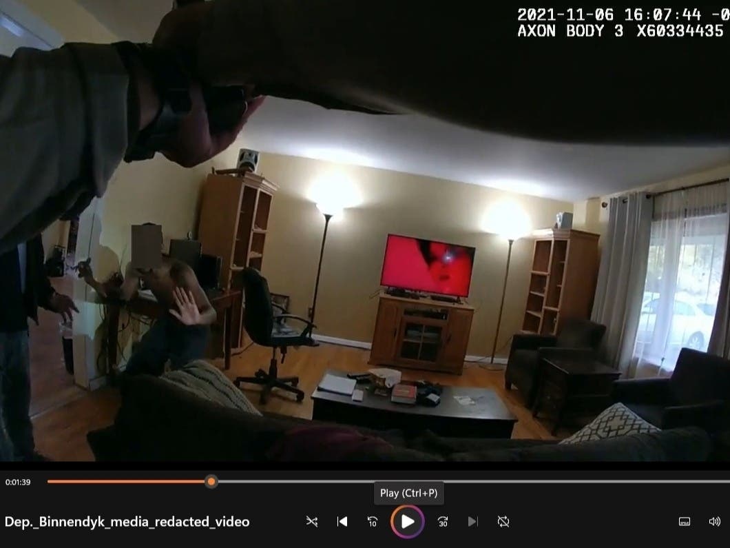 On Nov. 6, 2021, Jabbar Muhammad prepares to leap at his grandfather's neck after telling Will County Sheriff's Deputy Nick Binnendyk that he will not drop his knife. 