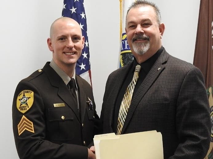In February 2022, Will County Sheriff Mike Kelley congratulates Sgt. John Allen on his promotion to lieutenant. Kelley and Allen are now co-defendants in a wrongful death lawsuit. 