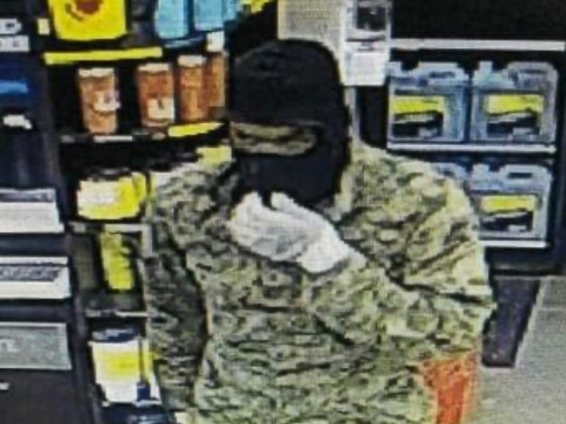 The Channahon Love's Travel Stop robber's getaway vehicle was a Nissan Armada that had stolen license plates on it. 