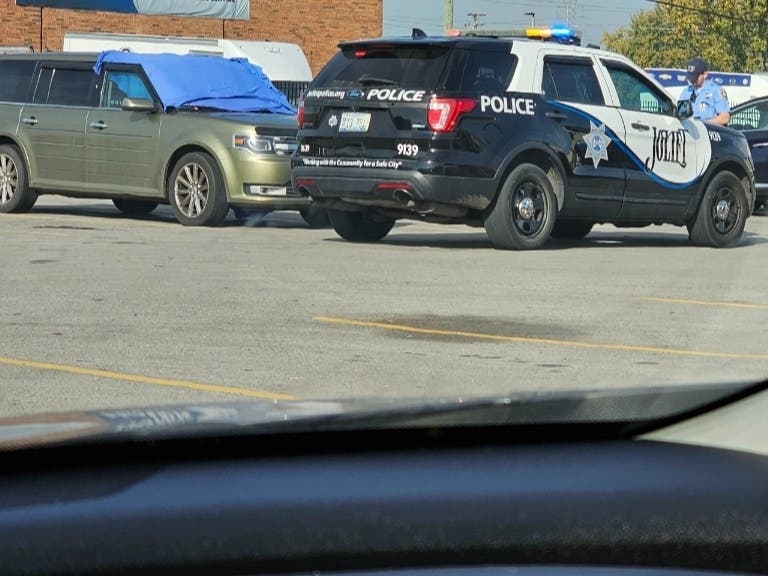 A body was found in the vehicle at the Planet Fitness on West Jefferson Street in Joliet. 
