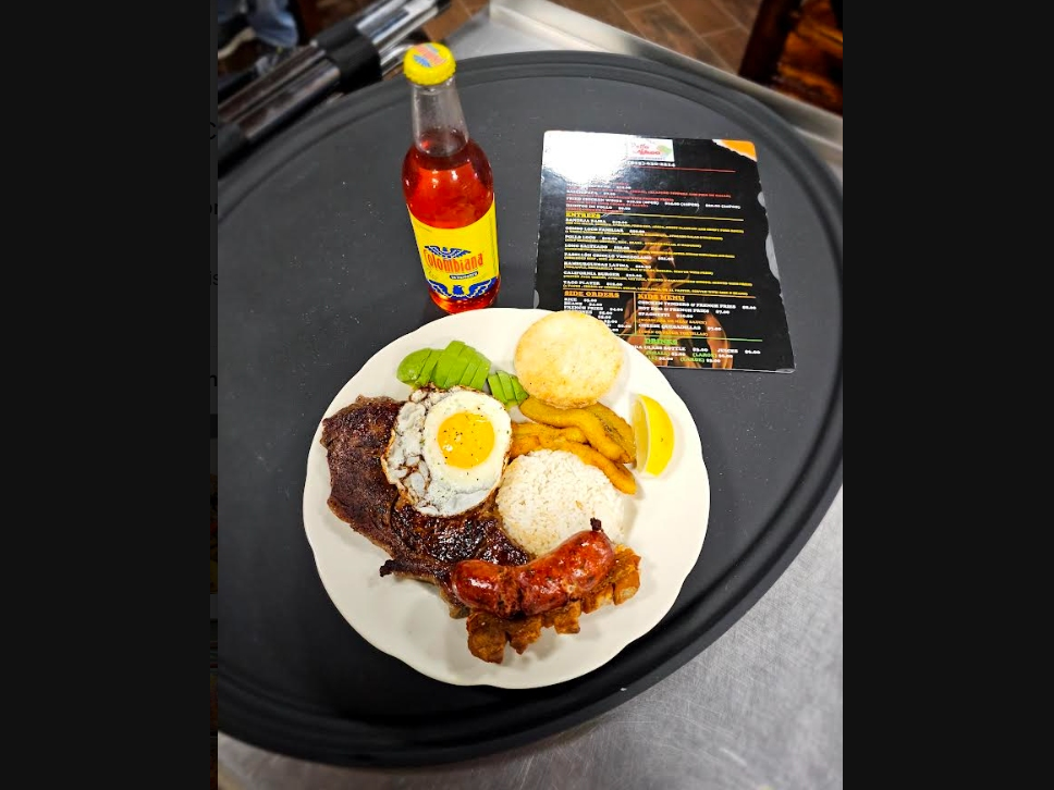 At $19, the Bandeja Paisa from Colombia is a ribeye steak with chorizo, avocado, fried egg, arepa, sweet plantain and crispy pork rinds. 