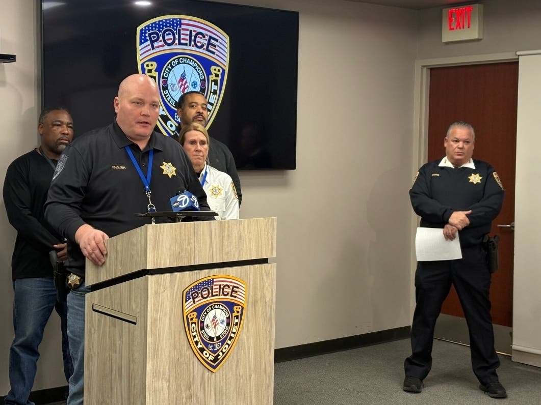 Joliet Police Spokesman Dwayne English addresses the news media during a Sunday afternoon press conference hours after a little boy and his mother were slain. 