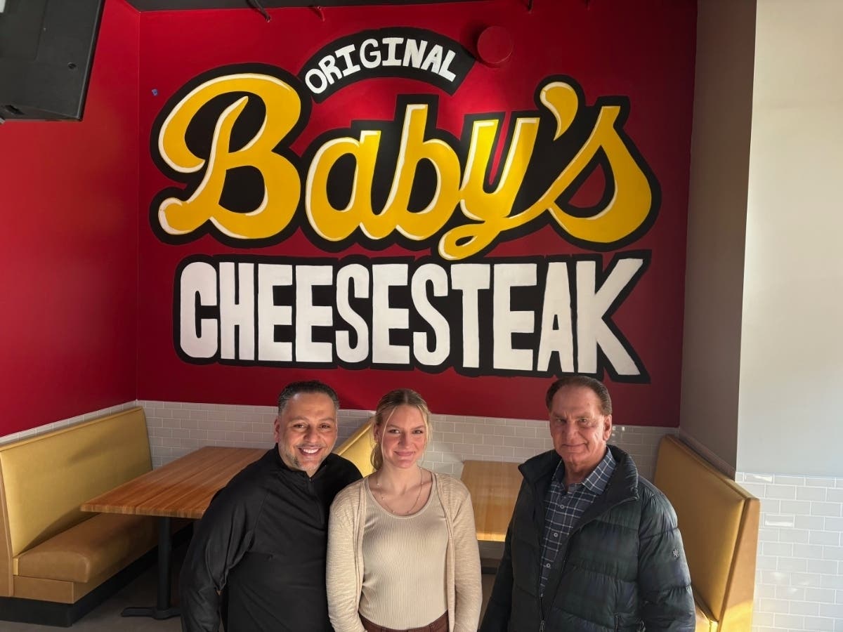 From left to right: Baby's Cheesesteak owner AJ Sughayer, managing partner Kaitlyn and John Bays owner of Bays Investments. Joliet's new Baby's Cheesesteak is at 203 N. Ottawa St. in downtown Joliet. 