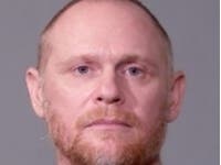 Adam Jaakkola turned himself in at the Joliet Police Department on Wednesday and he was processed on the charges and released on a notice to appear in court.