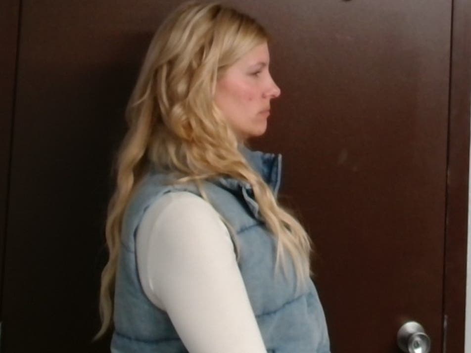 Police Officer Caitlin Mosier later spotted a woman who closely resembled Nora Koncel's description enter the driver's seat of the Buick Enclave and drive toward the Black Road 59, the forfeiture complaint indicated.