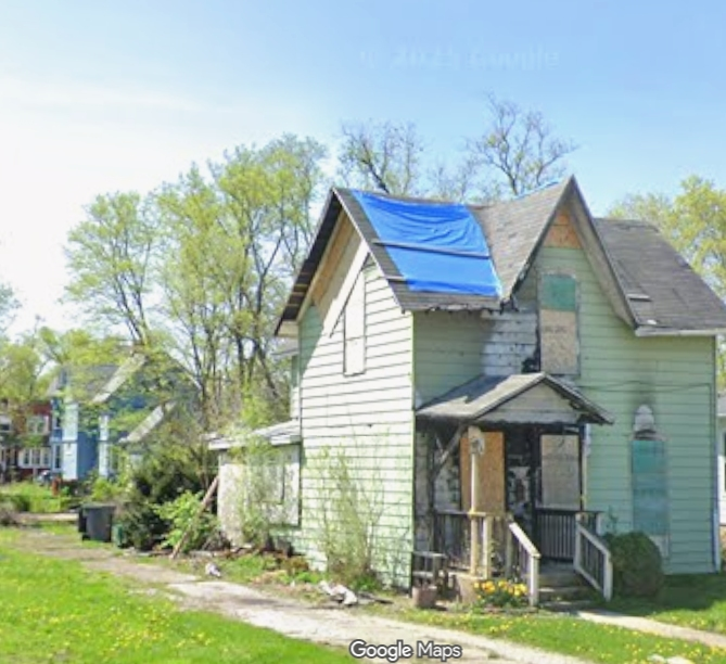 According to Joliet Director of Community Development Dustin Anderson's Council memo: the owners of this public nuisance at 216 3rd Avenue are George & Minnie Curtis.