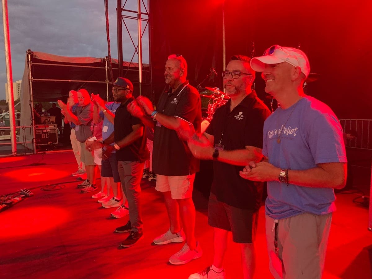 Joliet Park District Board members and administrators stand on the main stage during the last Taste of Joliet held in Memorial Stadium in June of 2025. 