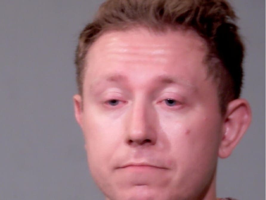 While in the booking area, police said Brian Krupa remained uncooperative and belligerent. As an officer attempted to search Krupa, he turned toward the officer and lunged at him, striking the officer in the chest with his shoulder, Joliet police alleged.