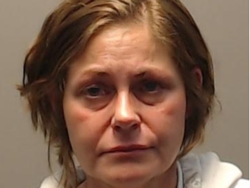 A Channahon resident, Nicole Petropulos, age 48, was arrested and charged with two counts of domestic battery and one count of interfering with the reporting of domestic violence, according to Channahon police.