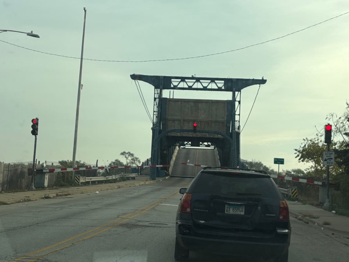This is your life, Joliet. At 8:40 a.m. Tuesday, while motorists try to get to work, the Illinois Department of Transportation's McDonough Street drawbridge through Joliet went up for several minutes because barge traffic is deemed a priority.