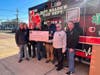 Senator Thomas presents a check to the East Meadow Fire District. L to R: Commissioner Keith Hoffman; Michael Cody, Engine 4; Chief Paul Kosiba; Commissioner John Priest; Senator Kevin Thomas; Commissioner Carey Welt; and Ex-Chief Thomas Tergesen.