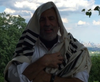 Rabbi Moshe Rudin of Adath Shalom shares a community prayer and sounds a ram's horn 