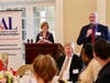 Kathy Jackson, Assistance League President, and Auctioneer Daniel Sanders of Four Sales Ltd