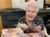 Assistance League Volunteer Prepares Books
