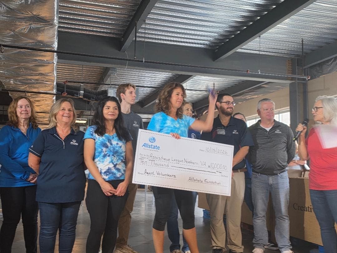Allstate employees and independent agents present donation to ALNV VP Carrie Sawicki