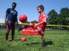  Local kids honed their soccer skills with New England Revolution players at a public clinic series in Boston, hosted by Santander on July 25.