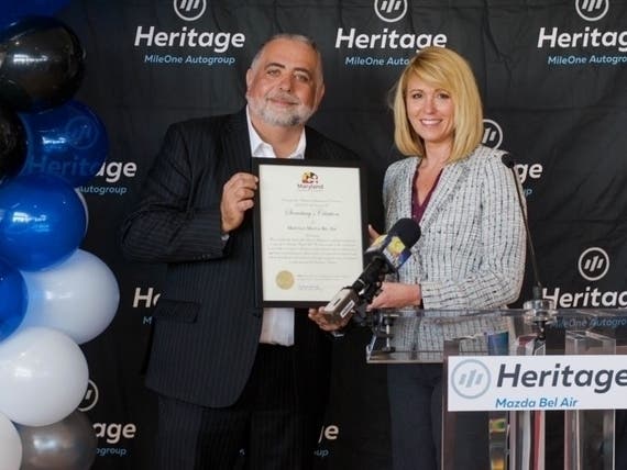 Heritage Divisional President Constantine Spivak with Alexandra Alexander, one of the five recipients who received a car today from Vehicles for Change and Heritage Mazda Bel Air.