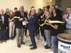 Cherokee HS Principal Todd Miller, left, and MUST Ministries President & CEO Dr. Dwight “Ike” Reighard cut the ribbon to officially open their partnership food pantry at the school...