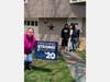  From left: Culinary Arts Teacher Mary Carter delivers a sign to Culinary Arts & Hospitality student Lee Williams,of Marblehead, and his family