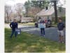 From left to right: Drama Club Advisors Alyssa Gibbs and Michelle Harding deliver signs to Kyle Gallucci , a member of the drama club from Beverly.
