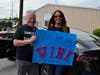 East Broadway Assistant Principal Milton Josephs (left) and Director of Elementary Education Michelle Kelly made a sign for the celebration.  