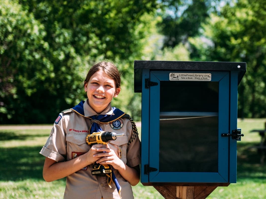 Kaylee Snyder of Scout BSA Troop 1920 came to the rescue to repair the Little Free Library after it was vandalized this spring on Thomas Street.