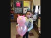 Third grader Liliana Sanchez-Sandkuhl showed off her pig balloon.