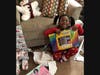 A delighted local recipient of Christmas gifts for the 2020 holiday season from Great South Bay YMCA’s  Adopt-A-Family initiative.