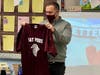 Students in teacher Vincent Amodio’s kindergarten class at Deer Park’s May Moore Primary School recently collaborated to make a card to commemorate the birthday of Principal Philip Paniccia, who was gifted a custom May Moore jersey by aide Alexis Tyson.