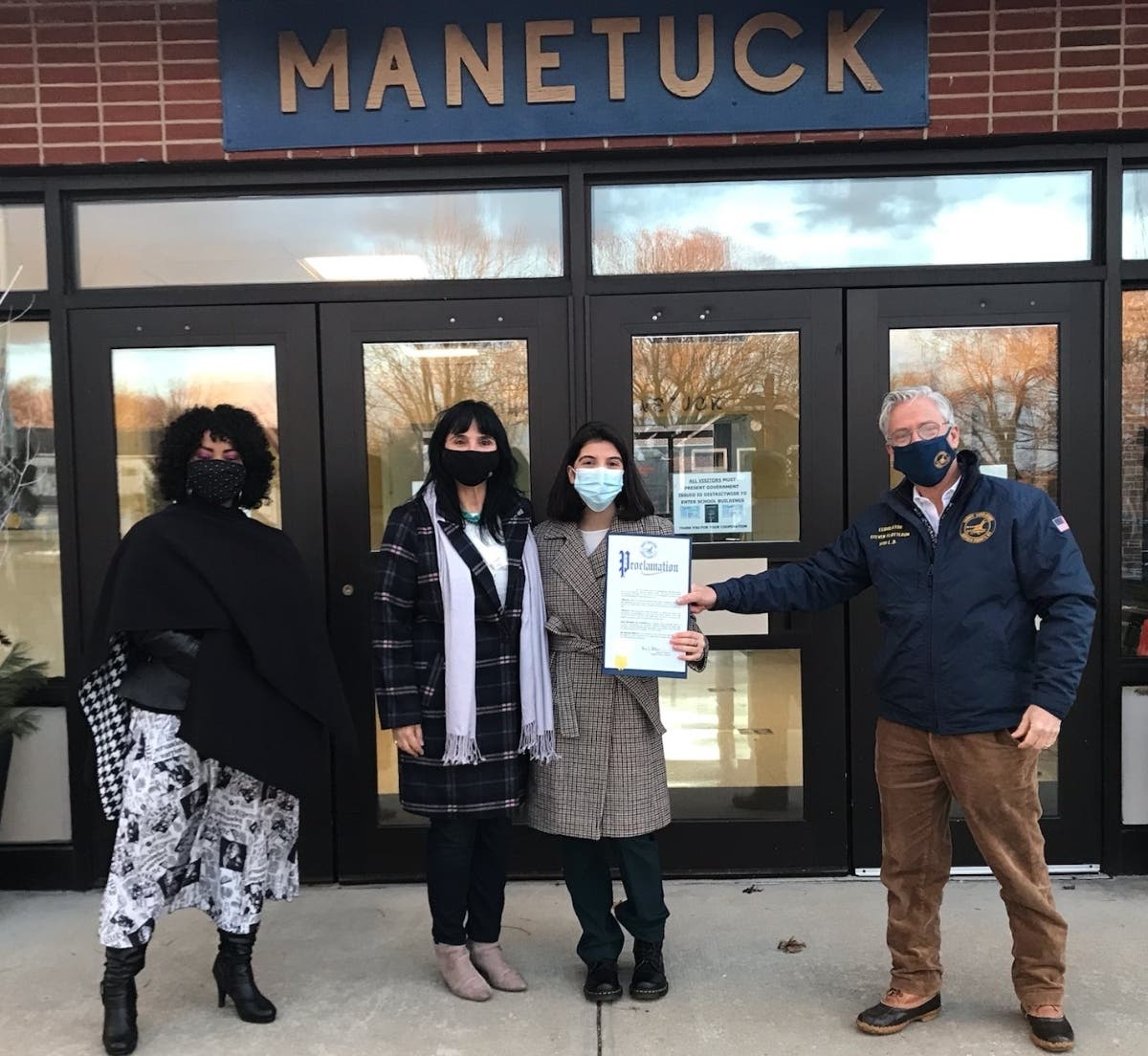 Manetuck Elementary School Building Principal Vanessa Williams, Award recipient’s mother Katie Zajmi, Gold Award recipient Deah Zjmi and Legislator Steven Flotteron.