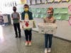 From left, Daniel Street Elementary School students Nick Reub, Noah Witherspoon and Victoria Stepczyk shared some of the class messages sent to local essential health care workers.  
