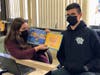 Student council members Emma D’Antonio and Patrick Lopez read “A Chair for My Mother” to fifth grade students of William Rall Elementary School on national Read Across America Day.