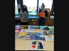 Pictured left, National Art Honor Society secretary Daniella Rivera and NAHS Vice President Lauren Russo with their “Frontline Hero” projects.