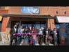 Hoboken Mayor Ravi Bhalla cuts the ribbon at the grand opening of Empyrean Indian Kitchen, alongside owners Sunil and Vanita Patel.