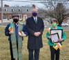 State Senator Kevin Kelly (center), joined by Father Pavia of Our Lady of Peace Church (left) presents Mary Ann Doonan (right) with an official citation recognizing her as “Irish Mayor for the Day” on March 17, 2021 outside of Stratford Town Hall.
