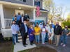 Luna Raymond, her husband and their two daughters celebrated the occasion with a ribbon cutting on the steps of the new home.