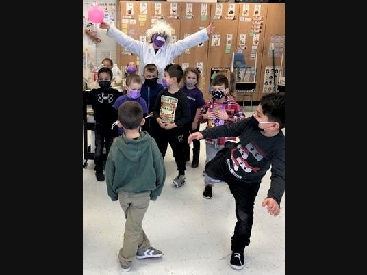 During this year’s Parents as Reading Partners project, West Islip’s Paul J. Bellew Elementary School Principal Rhonda Pratt – disguised as “Professor Pratt” – visited classes to demonstrate zany science experiments.