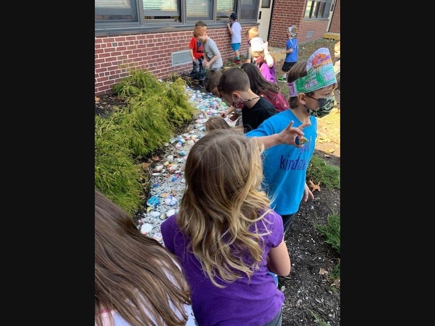 Kindergartners and first graders at West Islip’s Paul J. Bellew Elementary School recently participated in the school’s annual rock garden project.