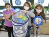 To learn about animal life cycles, second graders, from left, Christine Cavalluzzo, Grace McShane and Annelyse Ramirez got to watch caterpillars transform into butterflies. During the chrysalis stage, the creatures were kept in a soft cage.
