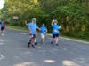 J-Cares Interns Moshe and his father, Zev, and Katie and her mother, Margaret at the start of the JCC Superhero 5K Race.