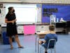 Extended School Year teacher Alyssa Young reinforces reading skills during an ESY elementary class.