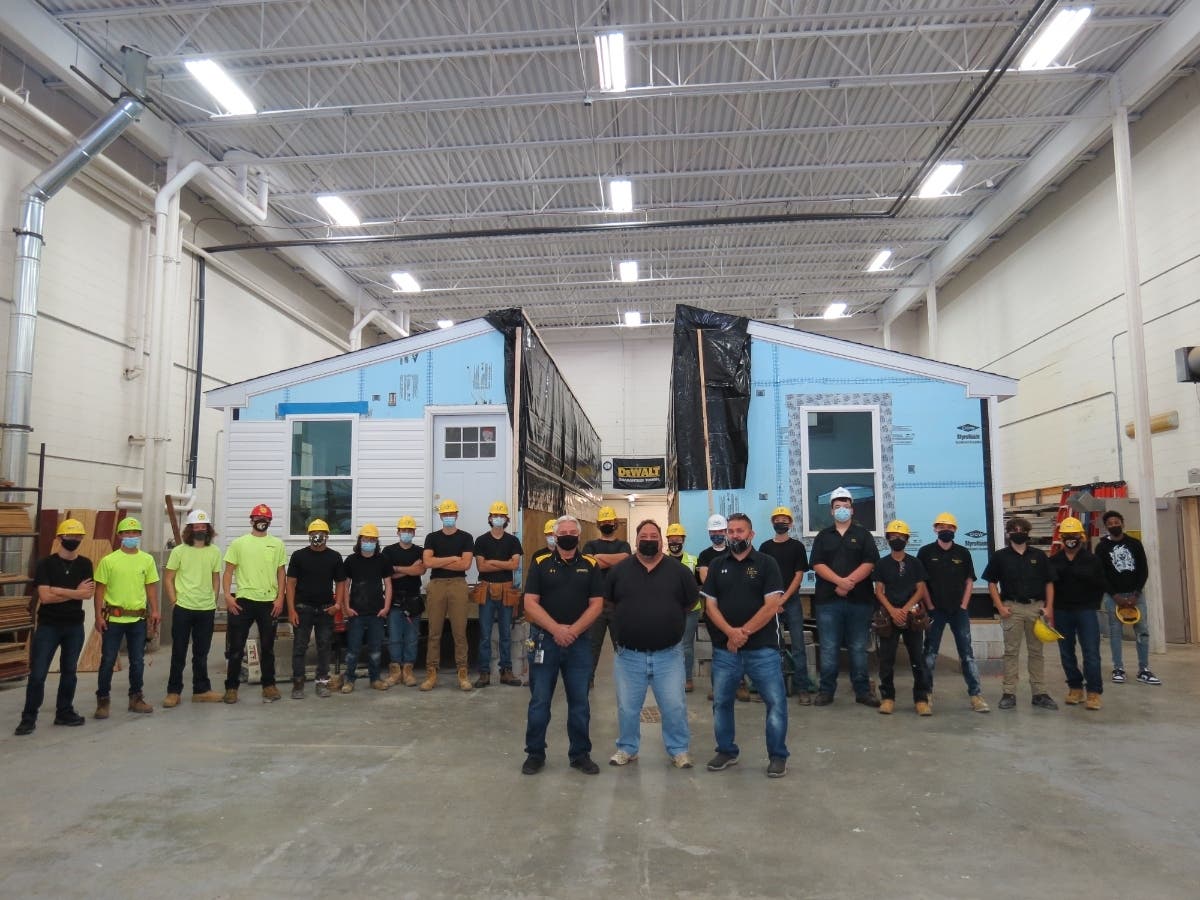 Students and teachers stand in front of the “Habi-Tech” house prior to its departure to
its final location on Edmund Street in Aberdeen.