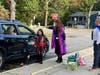 Edna Louise Spear Elementary School Principal Amy Laverty and Assistant Principal Brian Walker greeted a family.