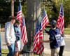 Members of the Earl L. Vandermeulen High School Varsity Club placed flags at the Armed Forces Tribute rock.